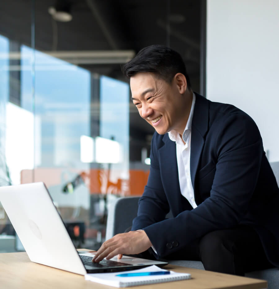 a business owner checking his laptop computer