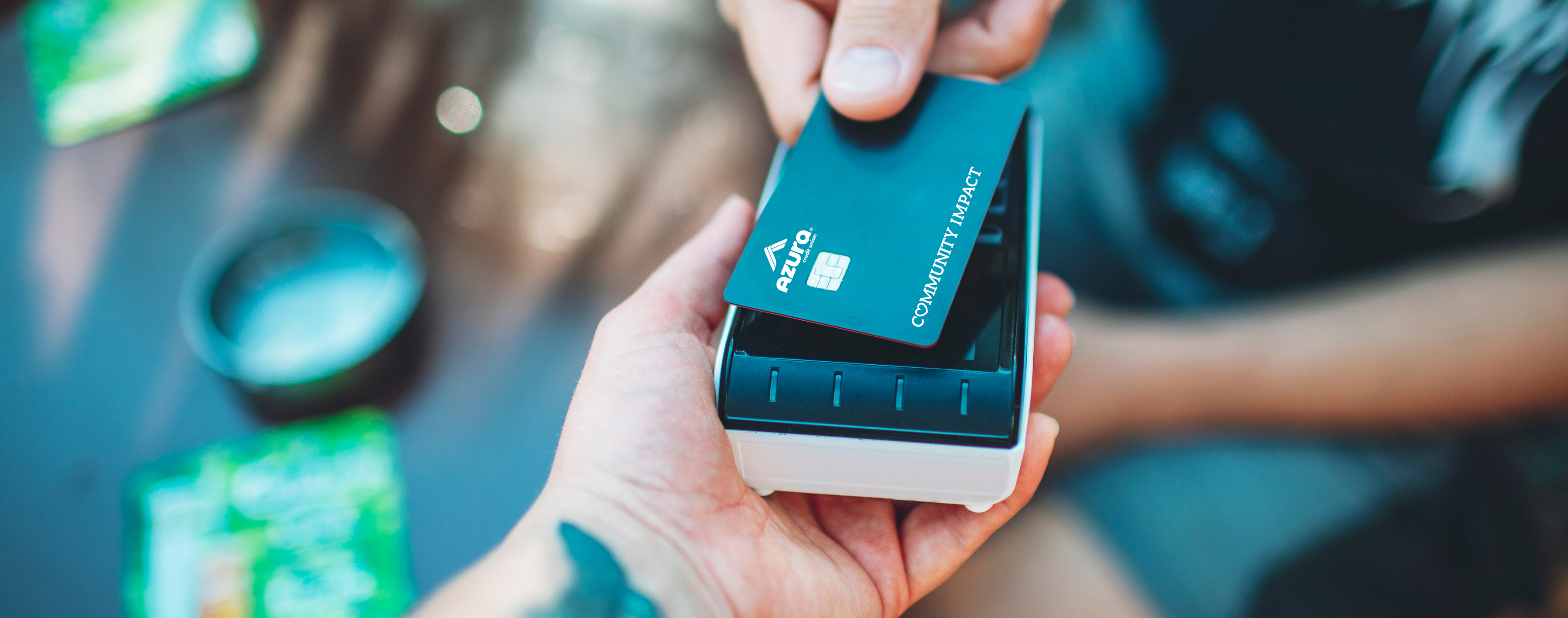 Azura debit card being used at coffee shop