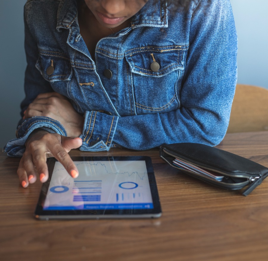 a person scrolling on their tablet