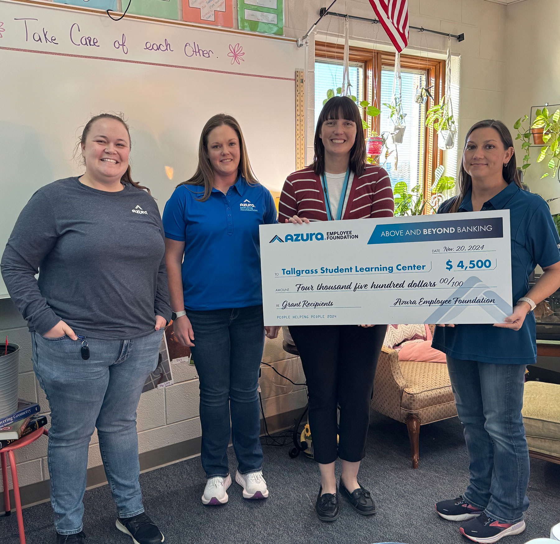 Azura check presentation to Tallgrass Student Living Center