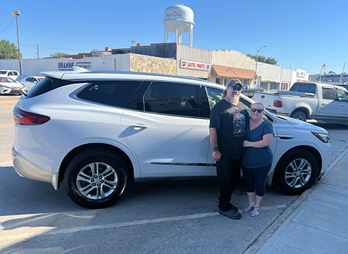 Azura member with white SUV