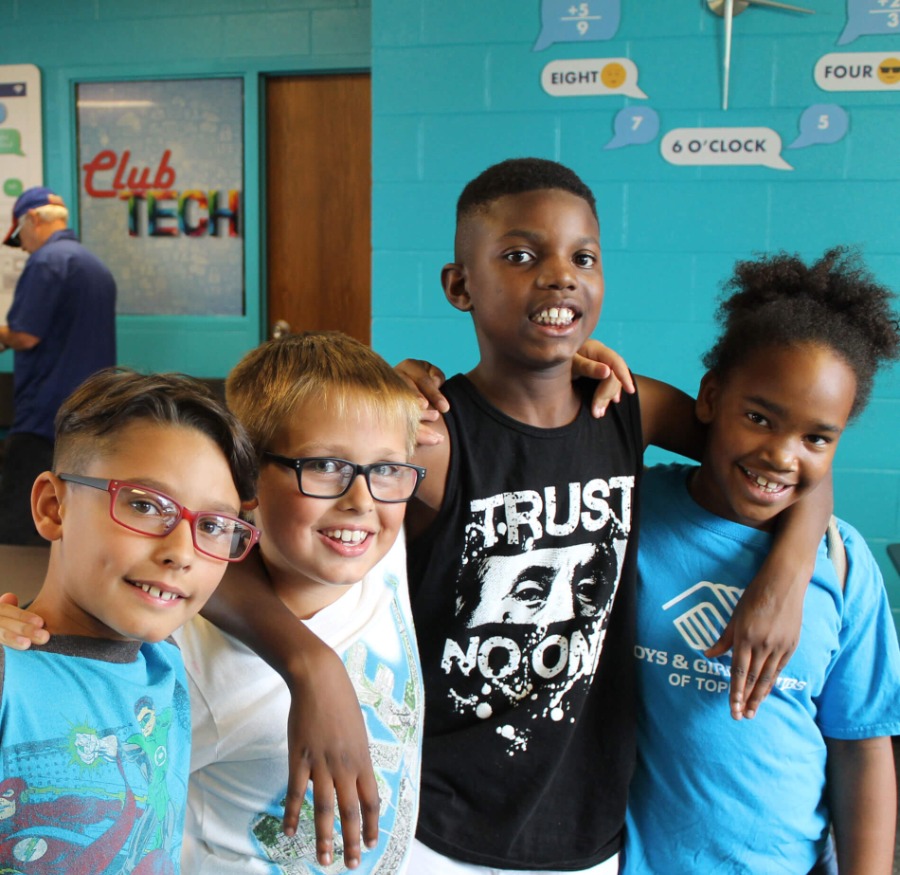 kids taking a group picture at the boys and girls club of topeka kansas