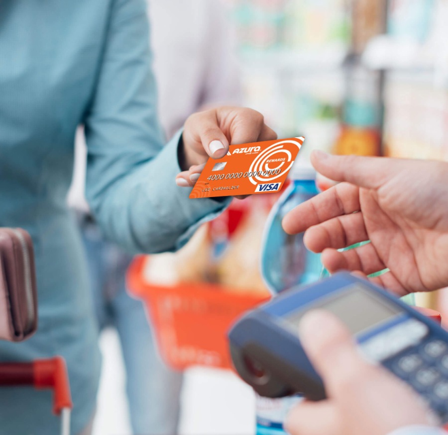 a person making a purchase with their Azura credit/debit card