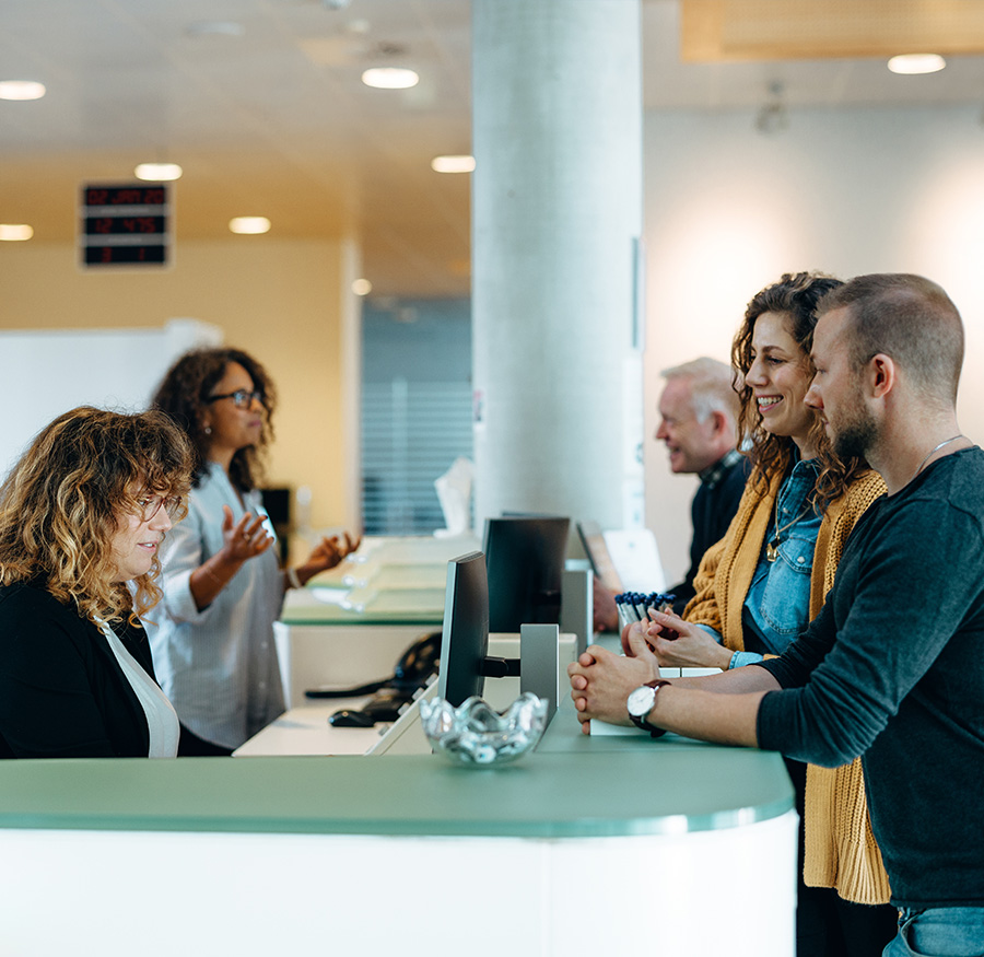 couple at bank counter with associate