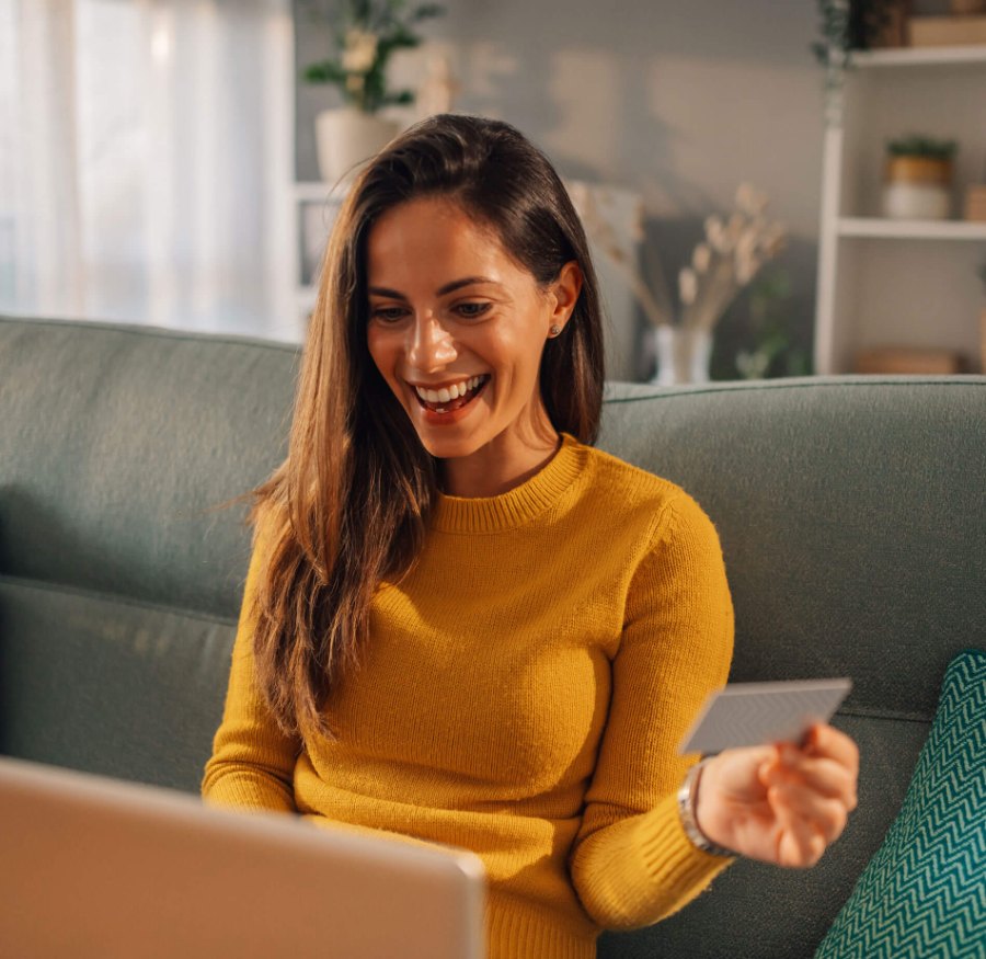 woman making an online purchase using a debit/credit card