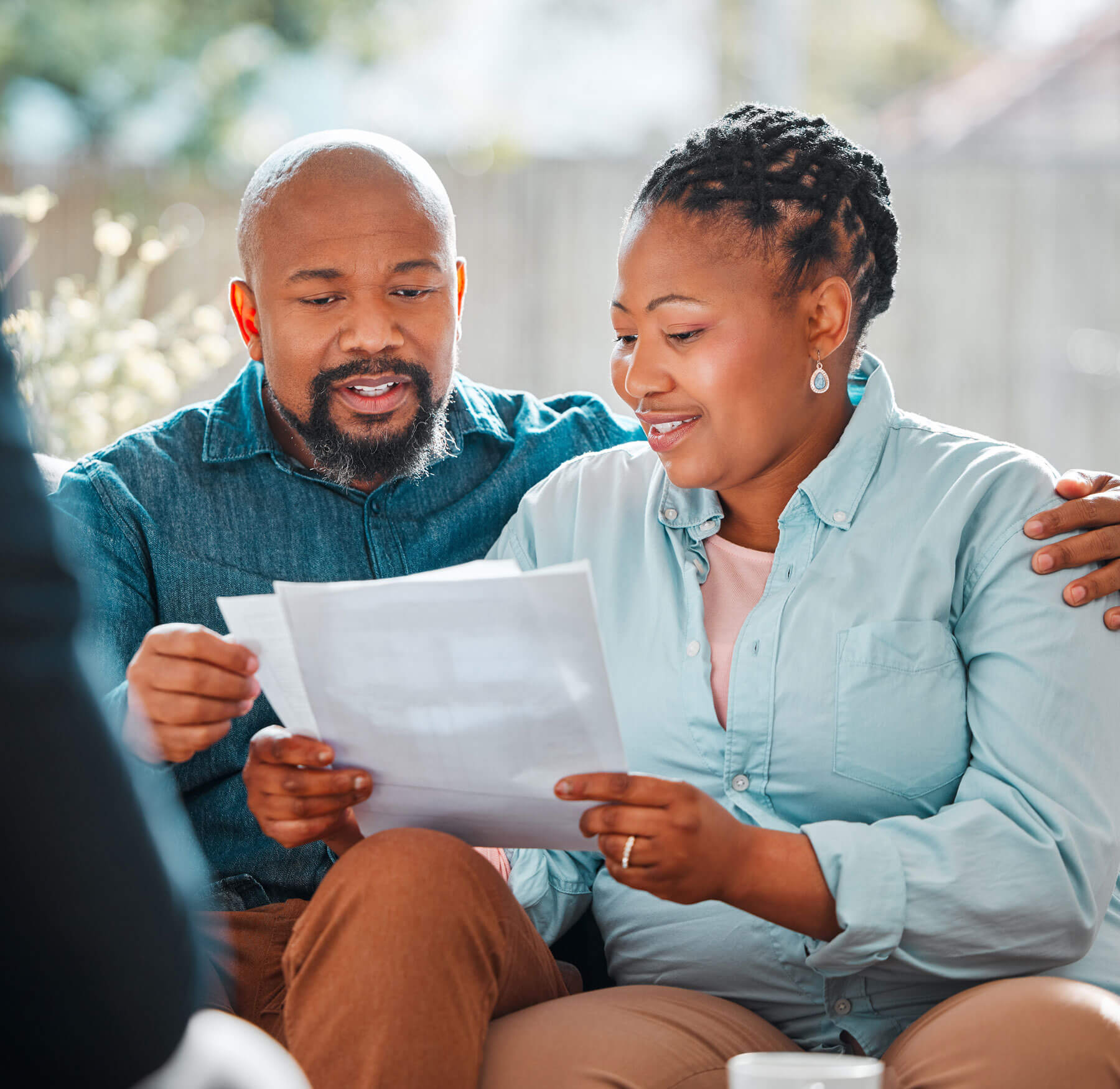 Man and woman reviewing their retirement details