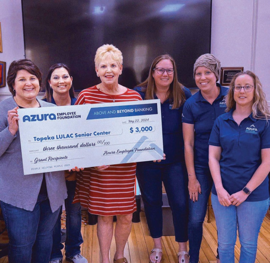 2024 Grant Recipients posing in front of a big check